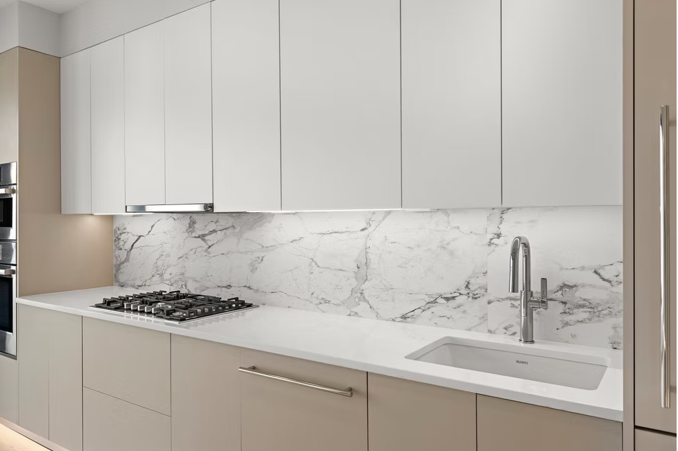 Marble splashback with stone worktop and undermount sink