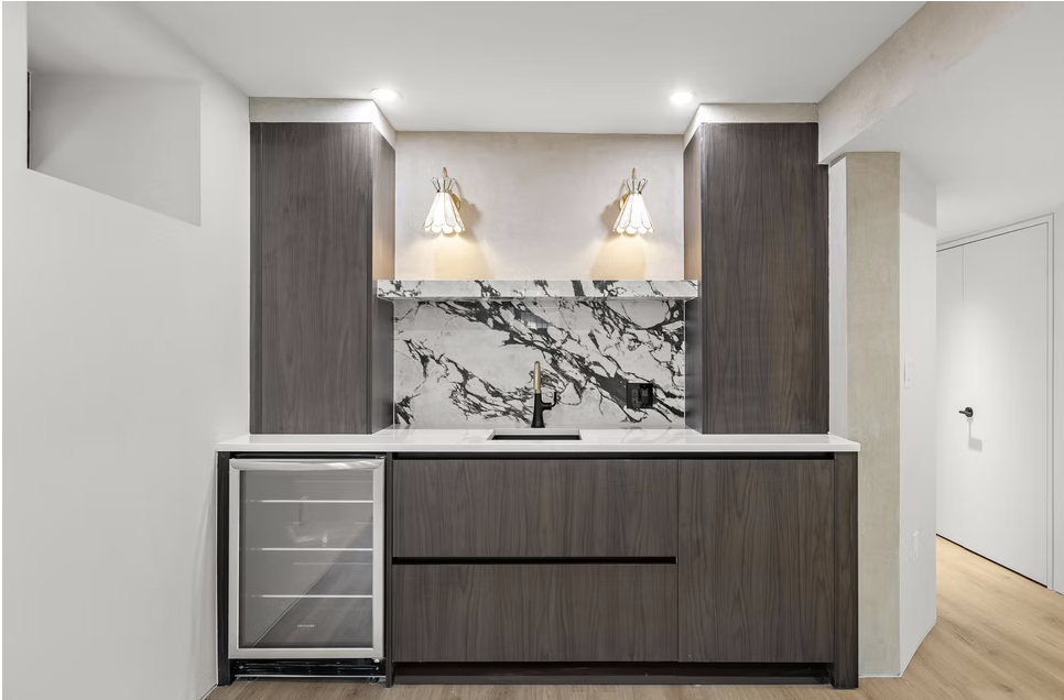 Bar joinery in walnut with marble splashback and wine fridge
