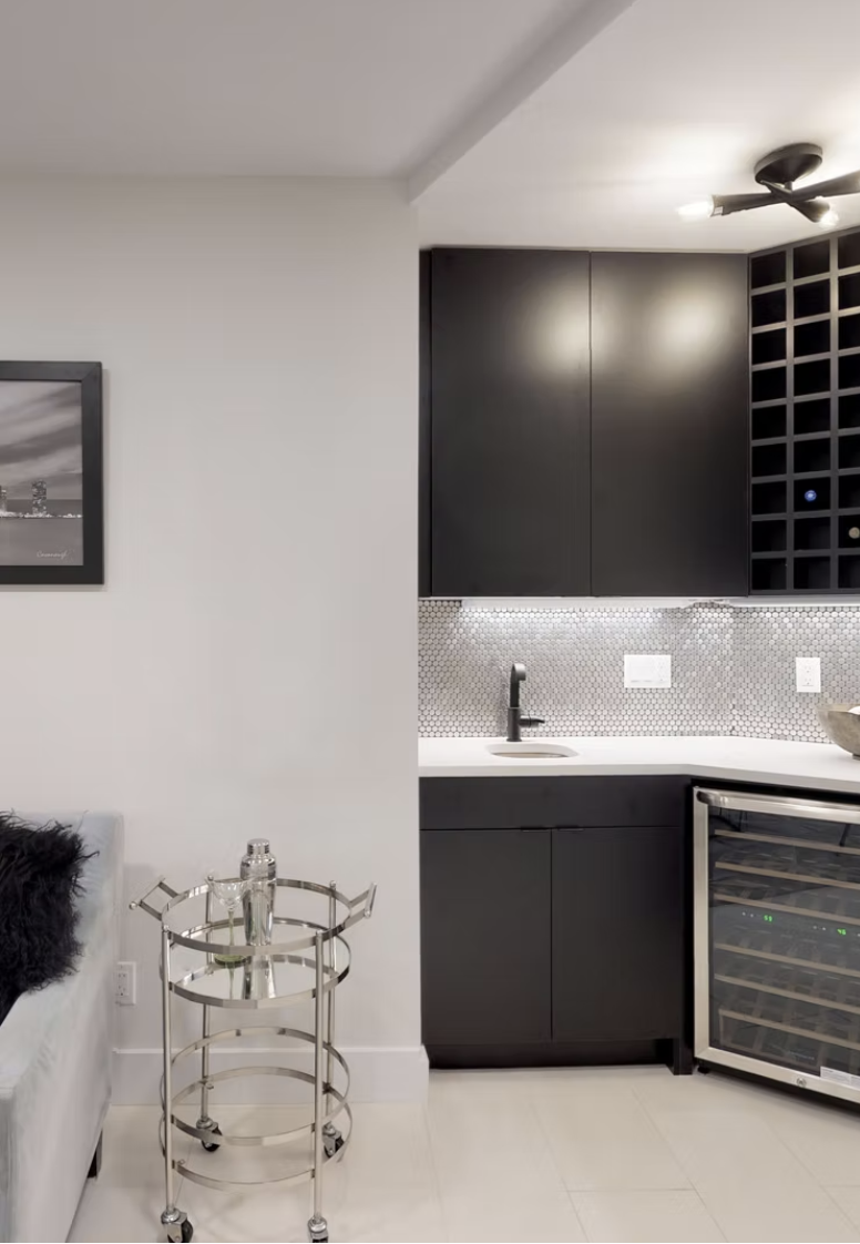 Black joinery bar with wine store, mosaic splashback and wine fridge