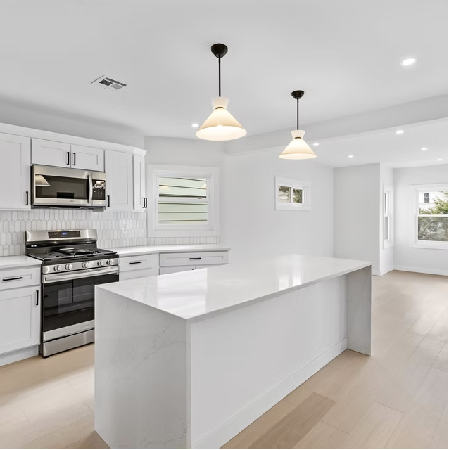 Kitchen island with waterfall stone worktop