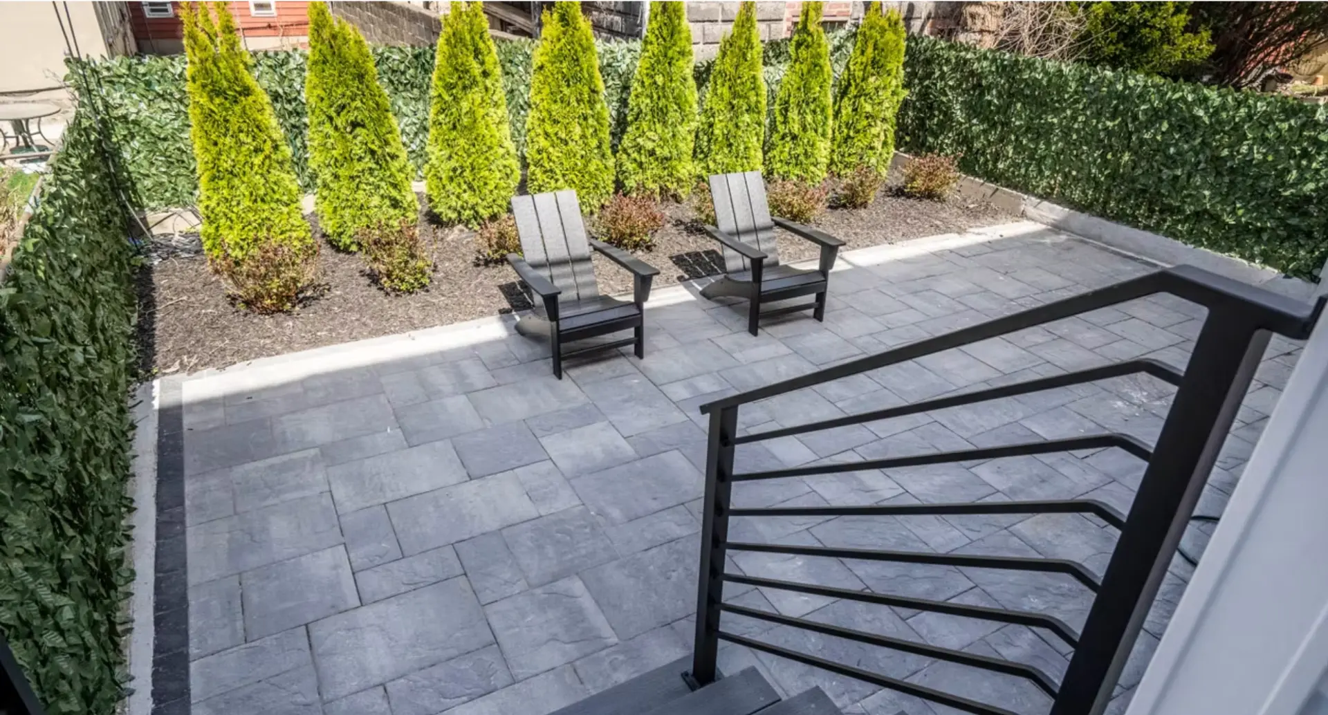 New paved courtyard with evergreen planting