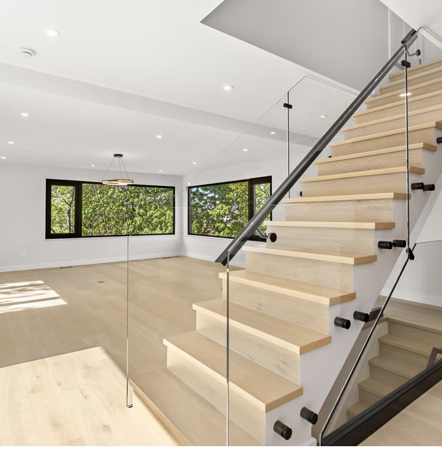 Oak stair and living room with garden outlook