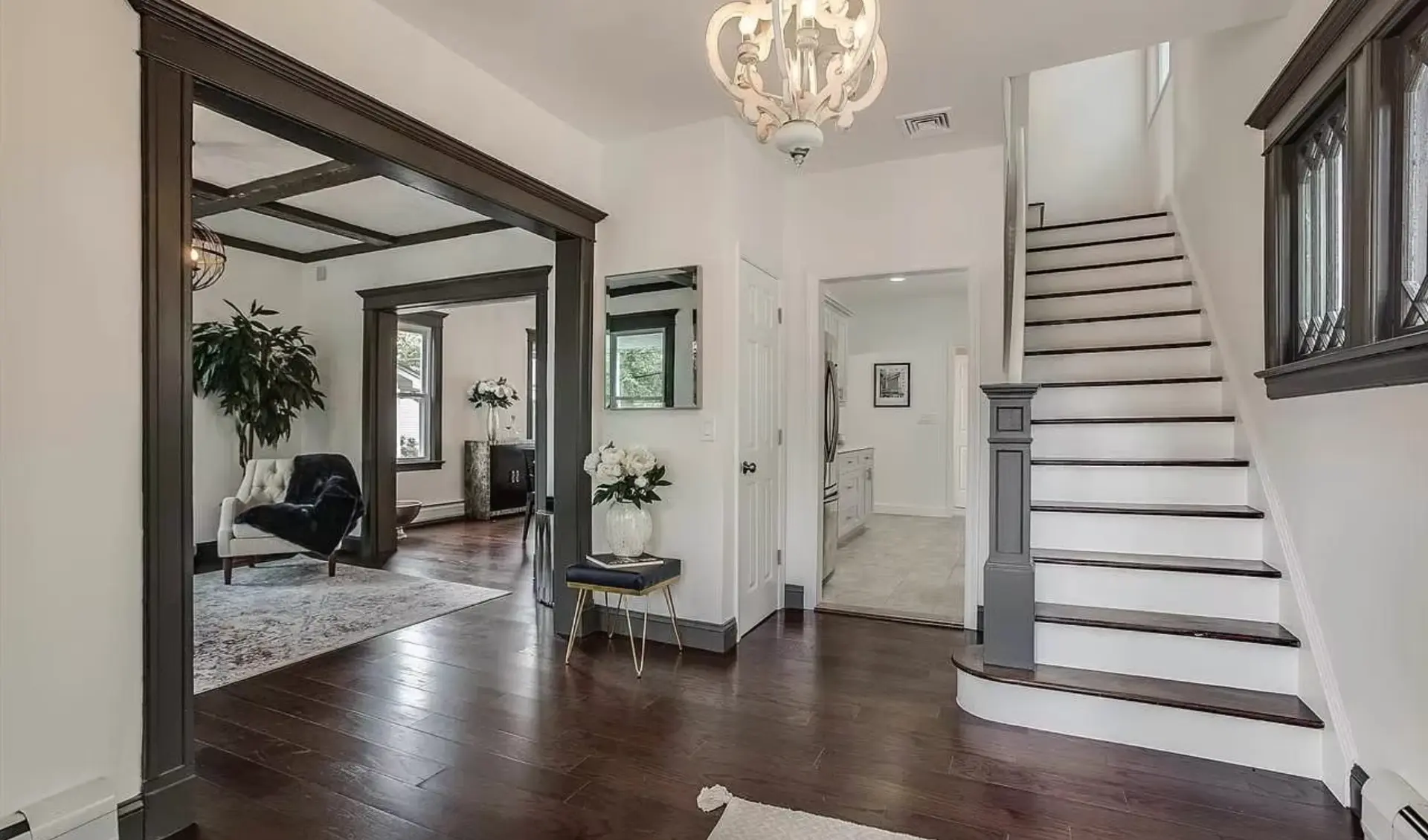 Entrance hall with restored stair and dark timber openings