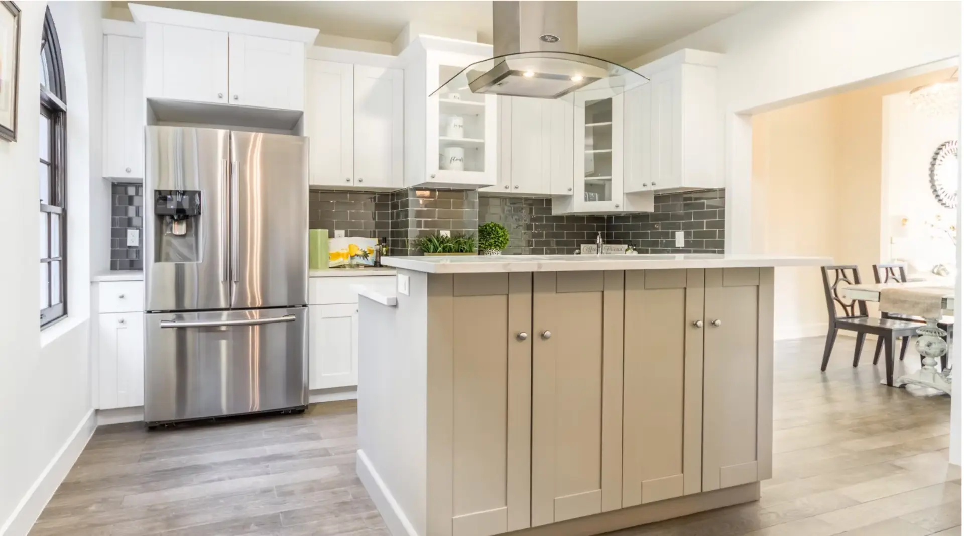 Shaker kitchen with taupe island and stone worktops