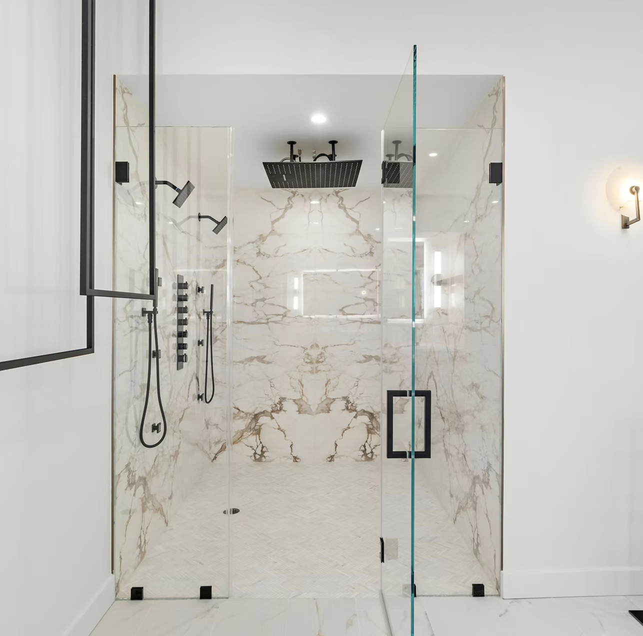 Book matched marble walk in shower with twin rainfall heads