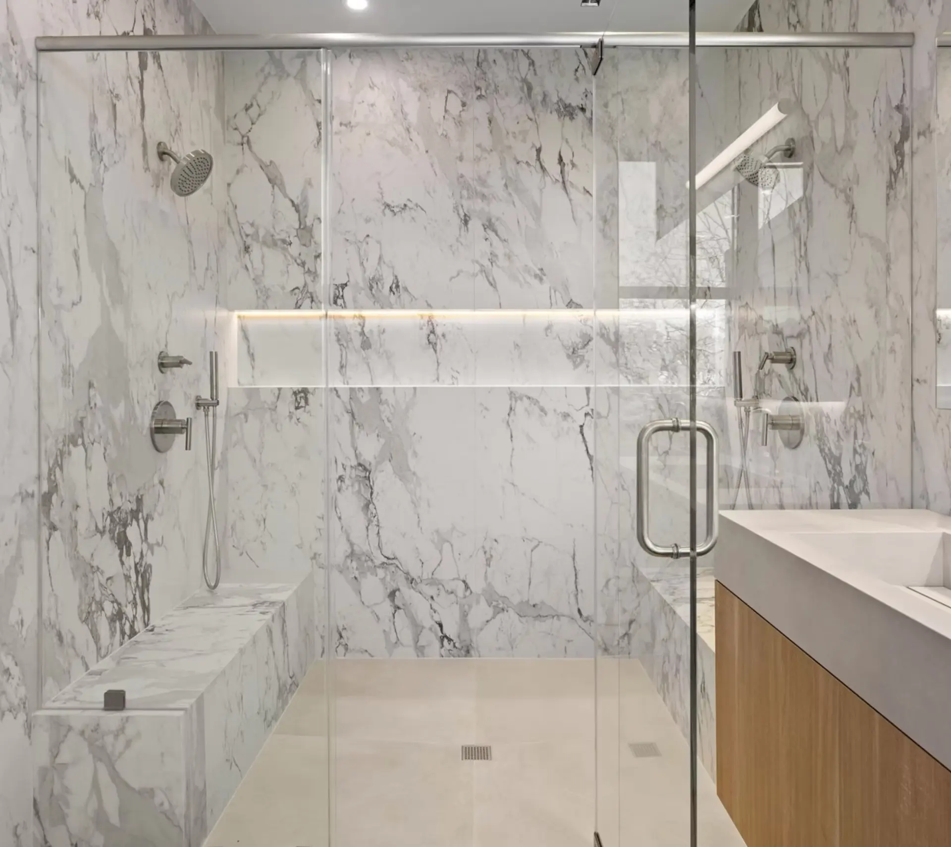 Marble walk in shower with twin rainfall heads