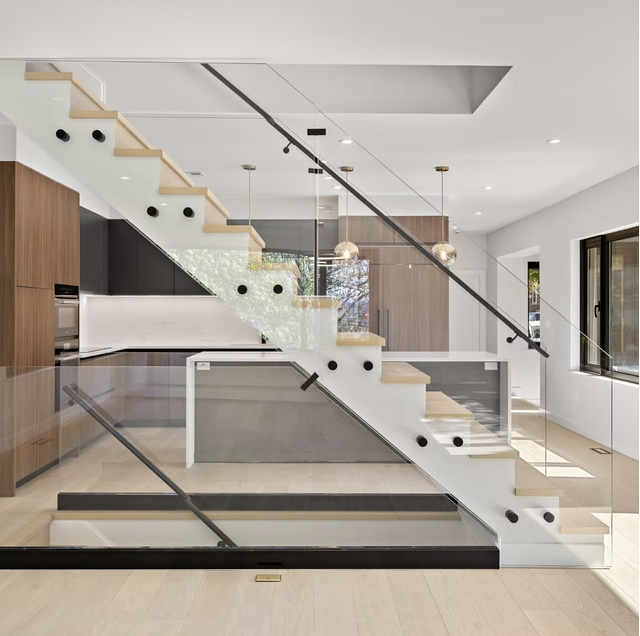Open tread oak stair with glass balustrade