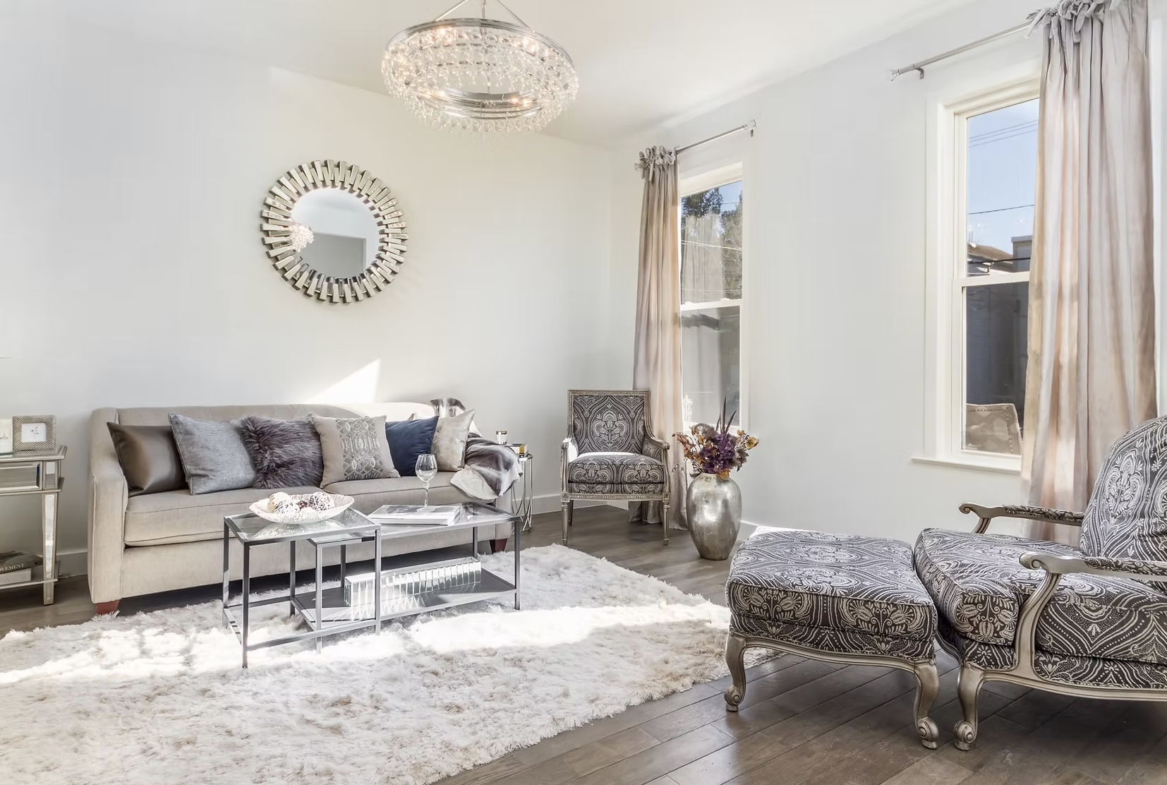 Bright front reception room with tall curtained windows