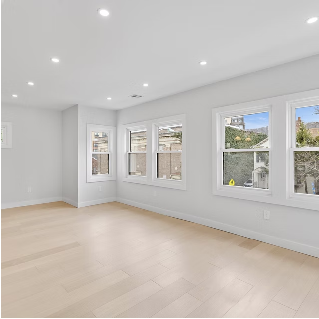 Upper floor room with garden and street views