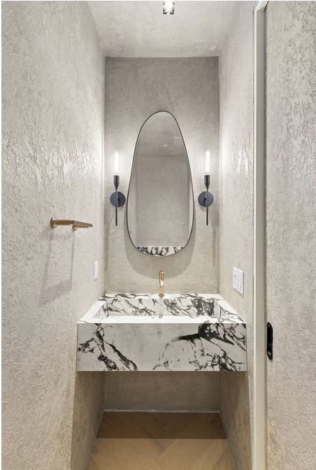 Cloakroom with micro cement walls and marble basin
