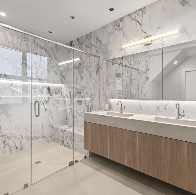 Marble bathroom with double vanity and walnut joinery