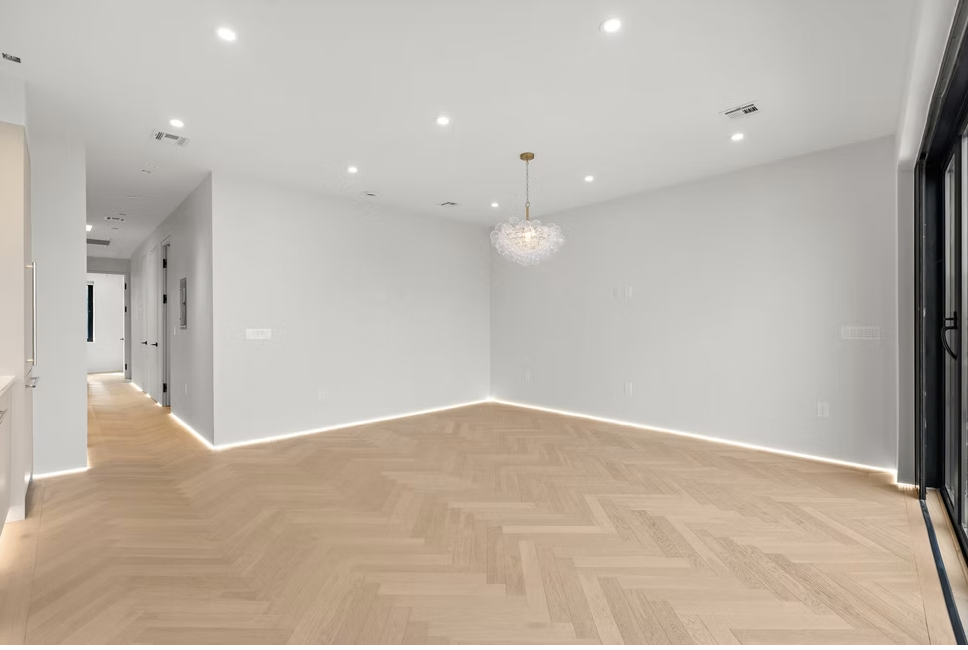 Bright reception room with glass pendant and LED skirting light