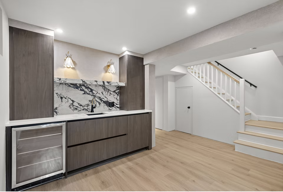 Lower ground living space with bar and stair beyond