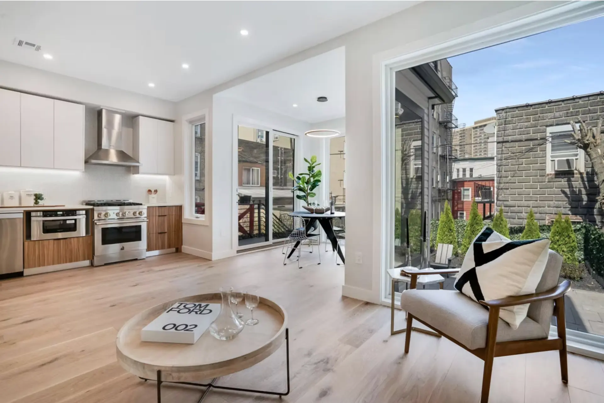 Open plan living and kitchen space with sliding doors to the terrace