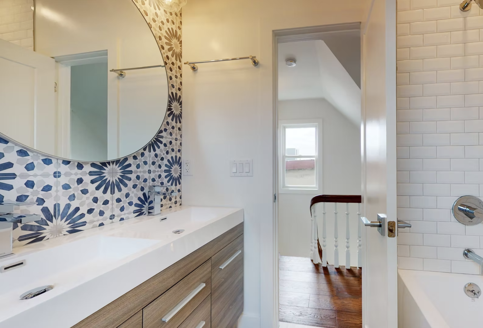 Shower room with double trough basin, timber vanity and patterned tiling