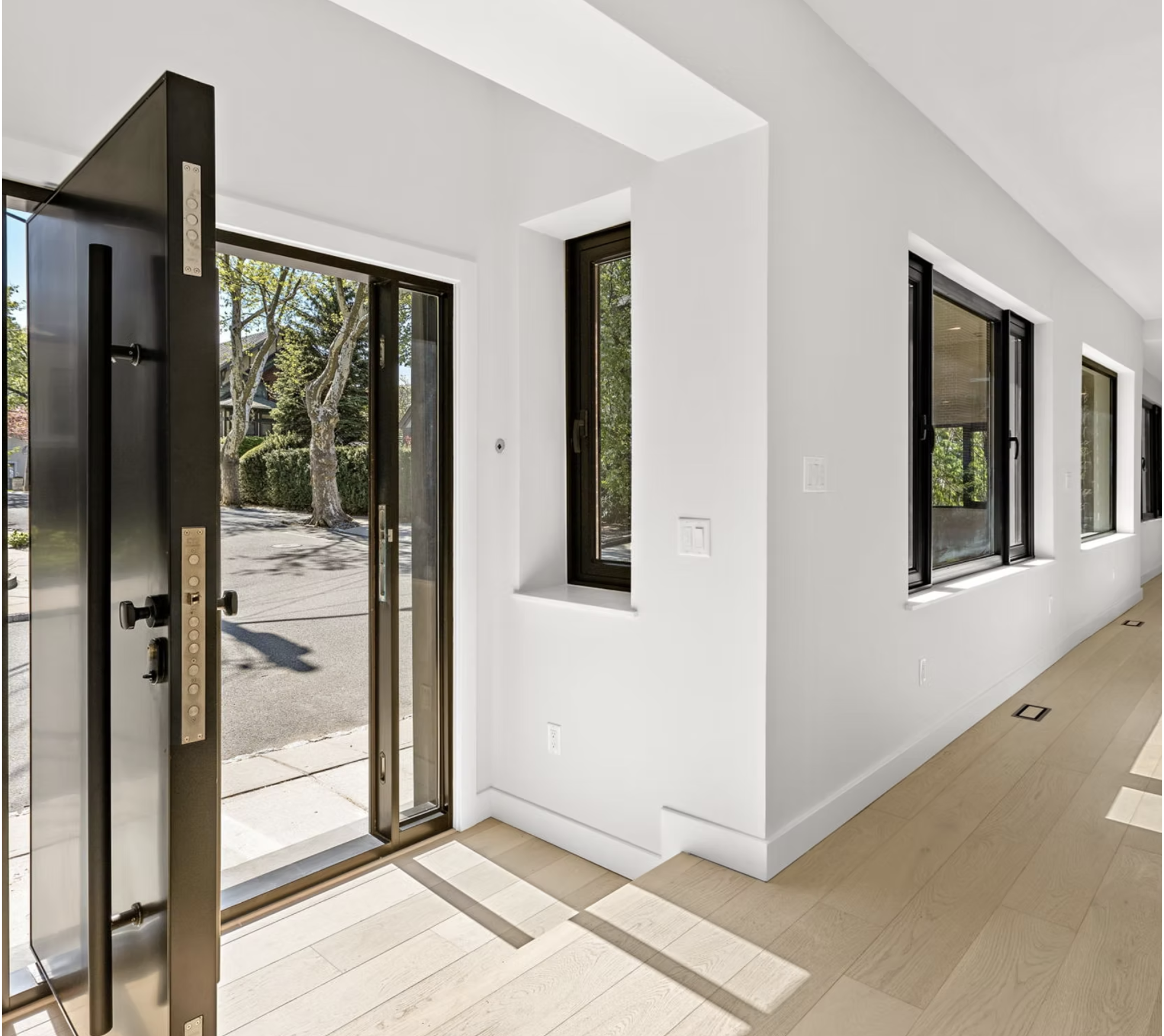 Entrance hall with bronze framed door and run of windows