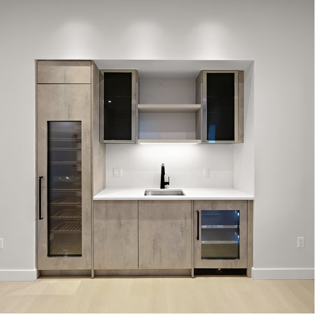 Bar joinery with wine fridge and stone worktop